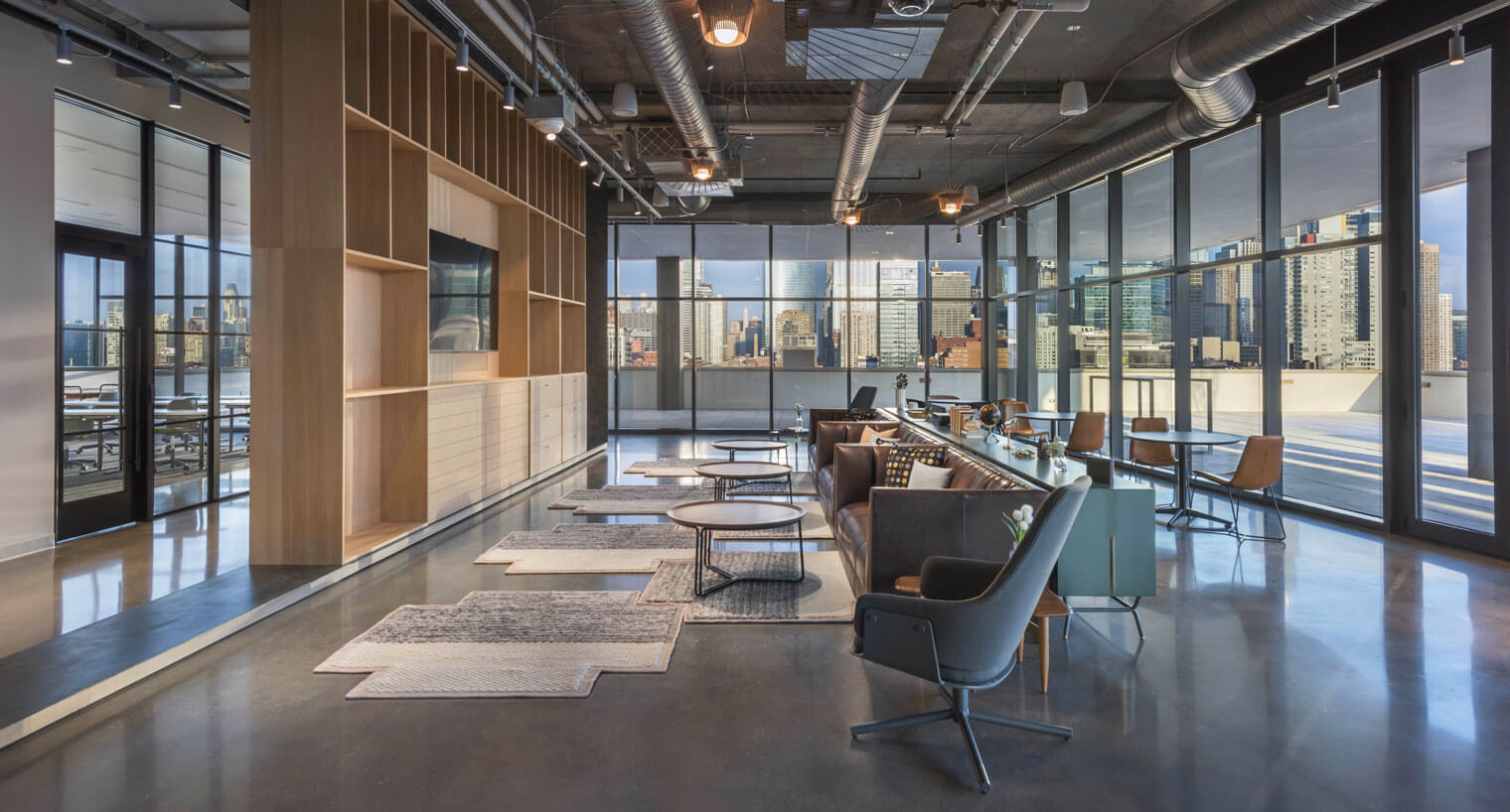 Community space with seating and wall-mounted tv