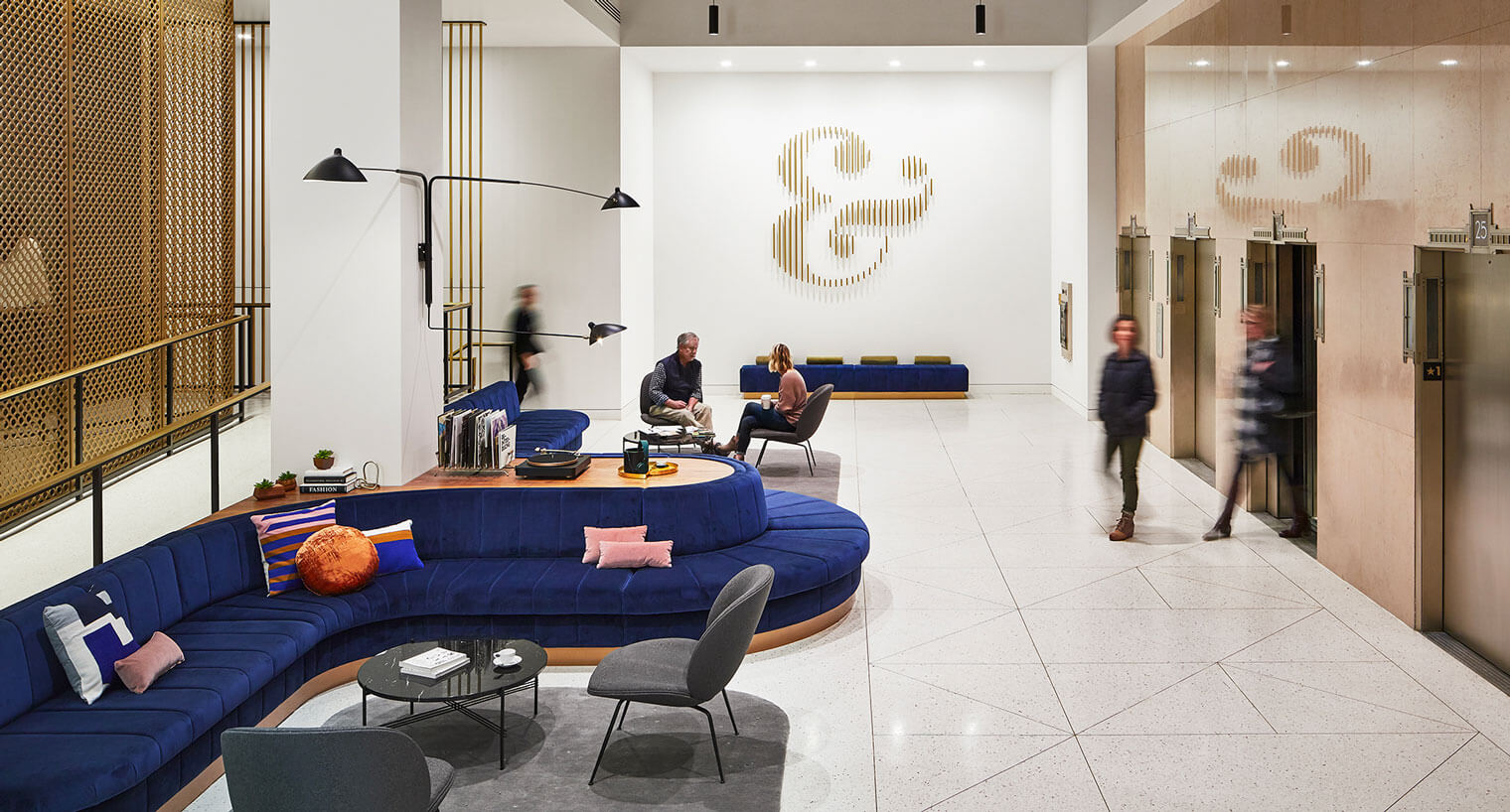 Elevator bank of Meir and Frank lobby with blue velvet furniture