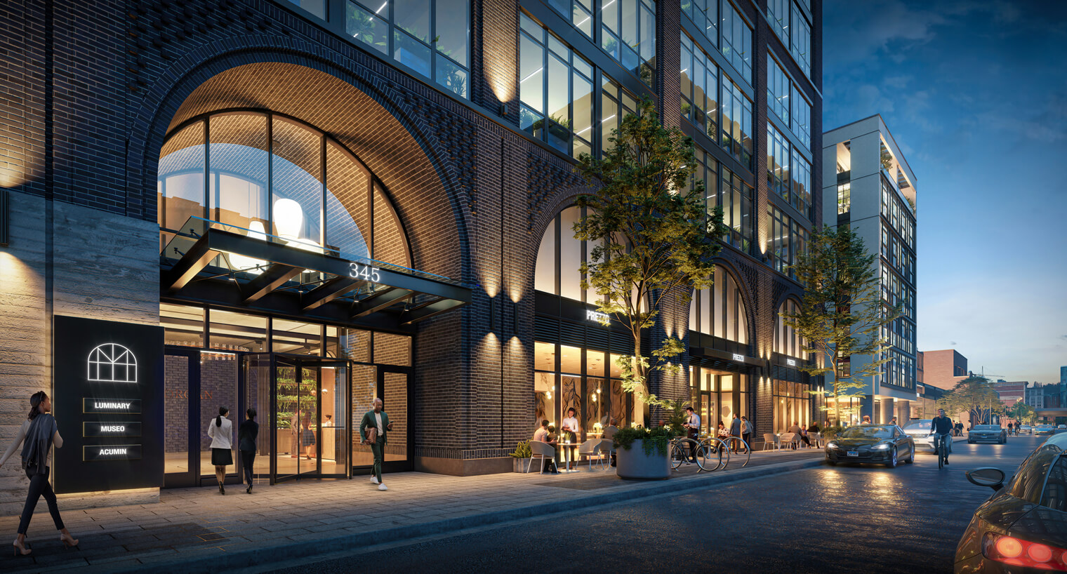 Building entrance to 345 N Morgan on busy city street at sunset