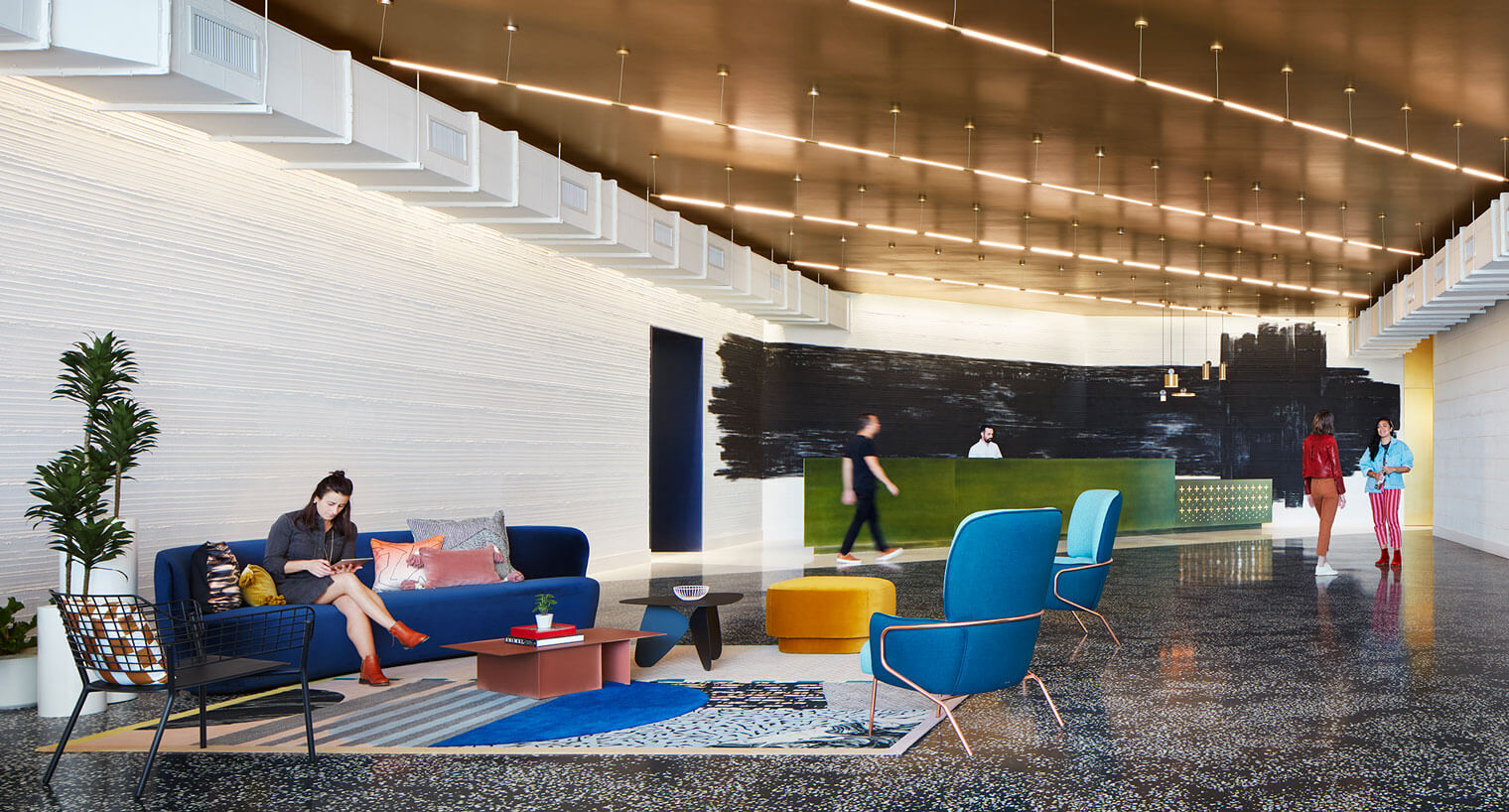 Tenants use the reception area of 545 Wyn with decorative tile floor