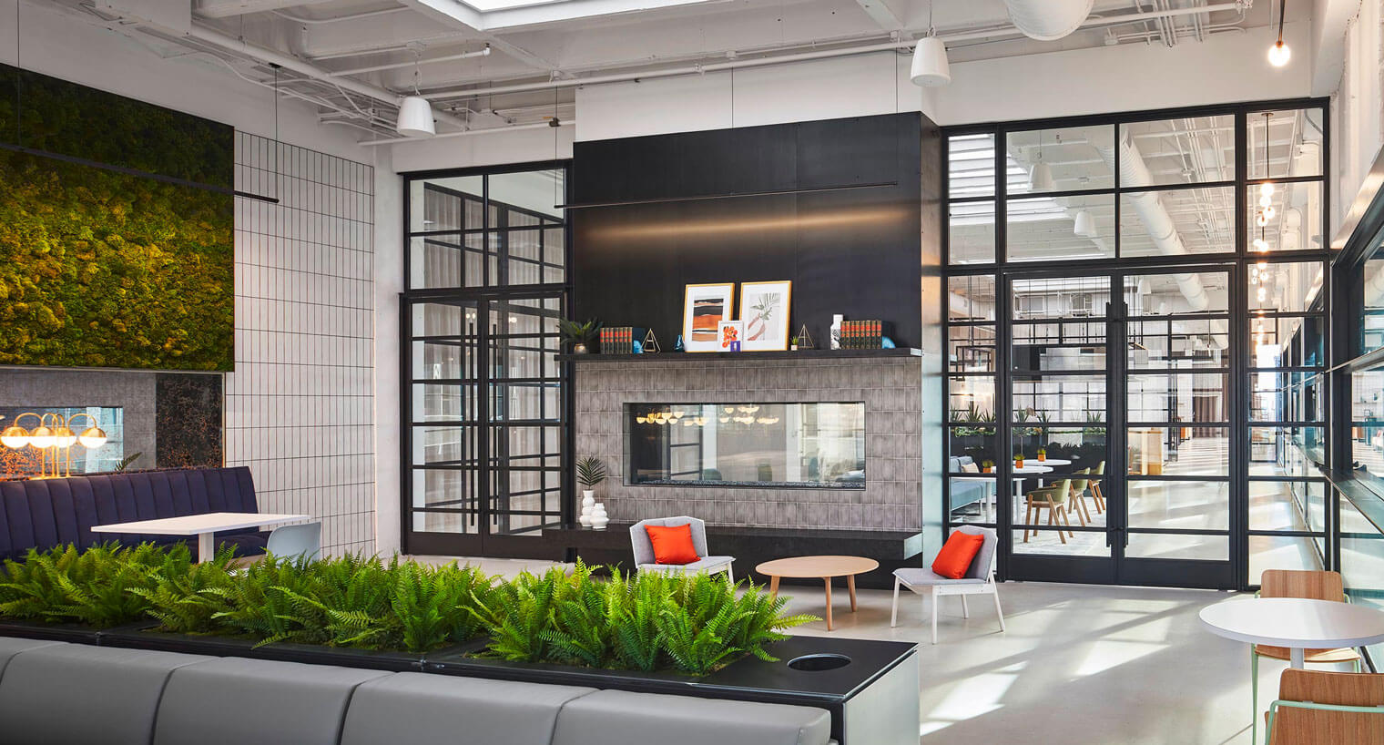 Community area with built-in fireplace and decorative greenery