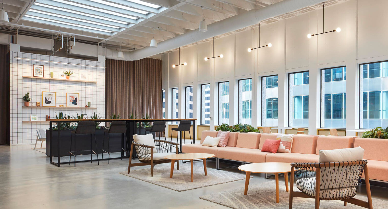 Communal seating area with decorative shelving and lighting