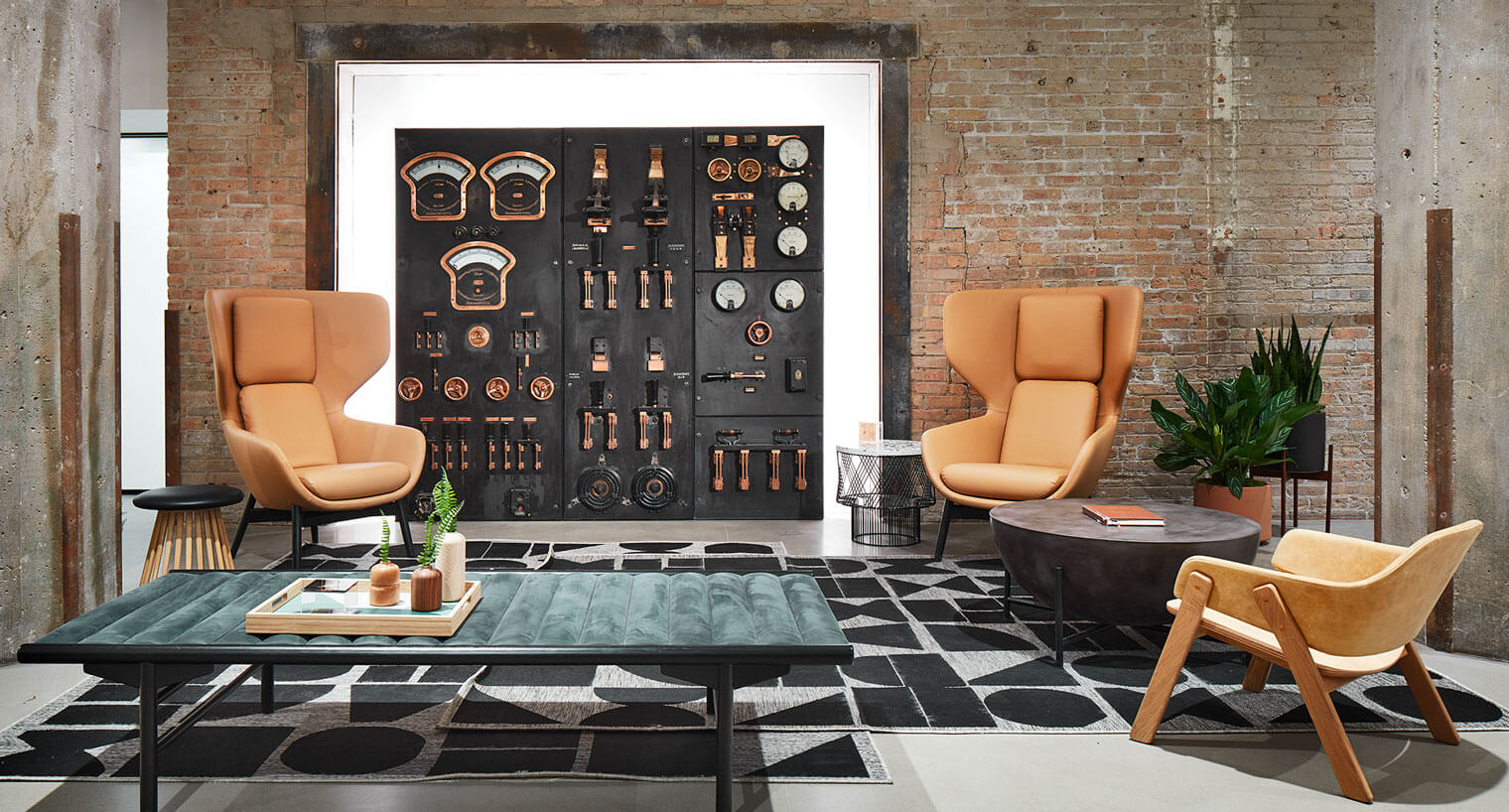 Corporate lobby area with tan brick wall and repurposed electric panel