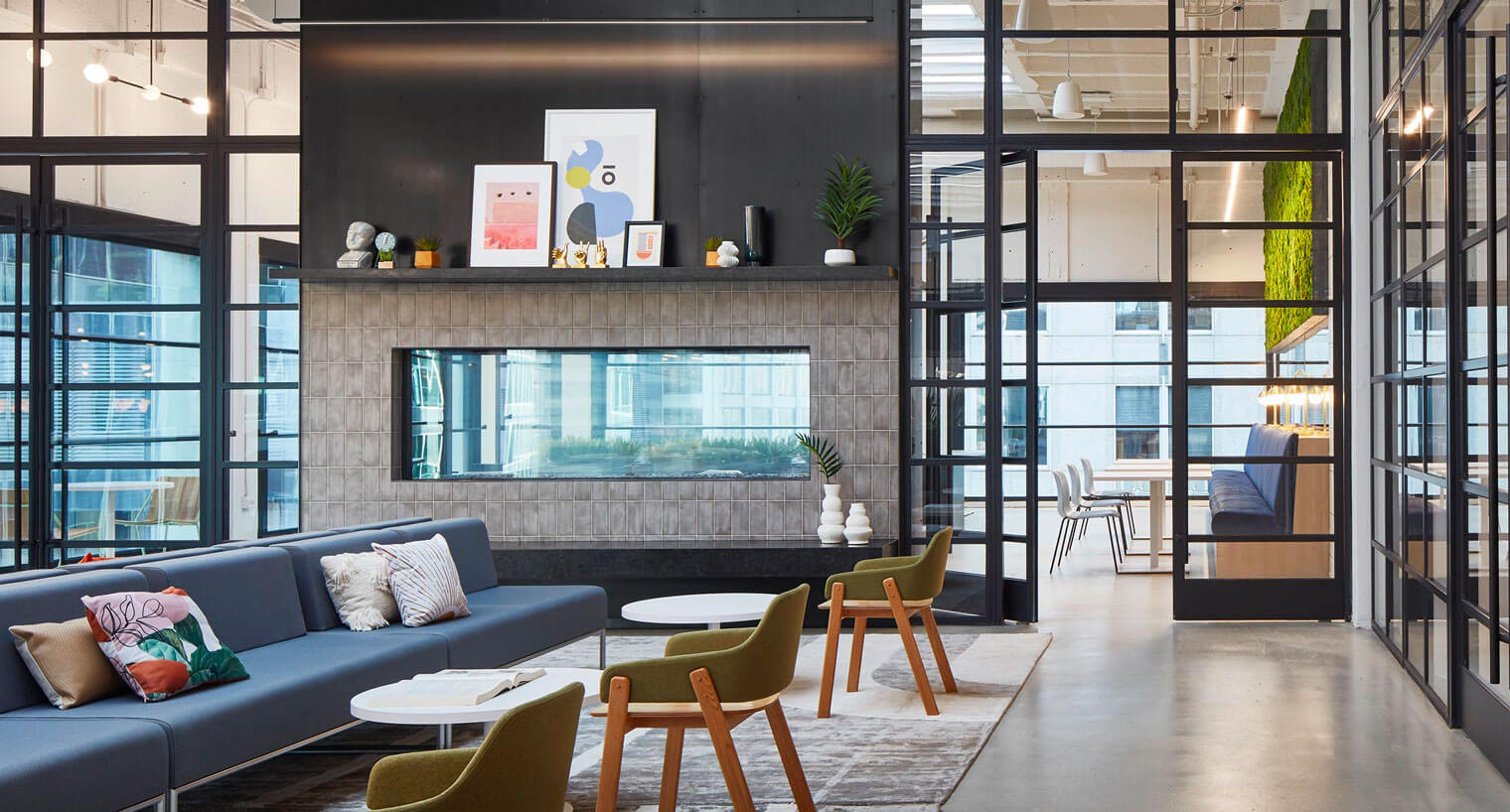 Community area with couches and chairs and built-in fireplace