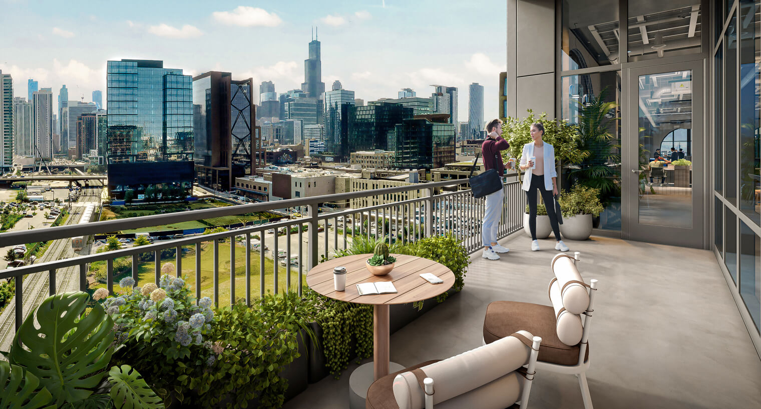 A man and a woman talk on a balcony overlooking downtown Chicago