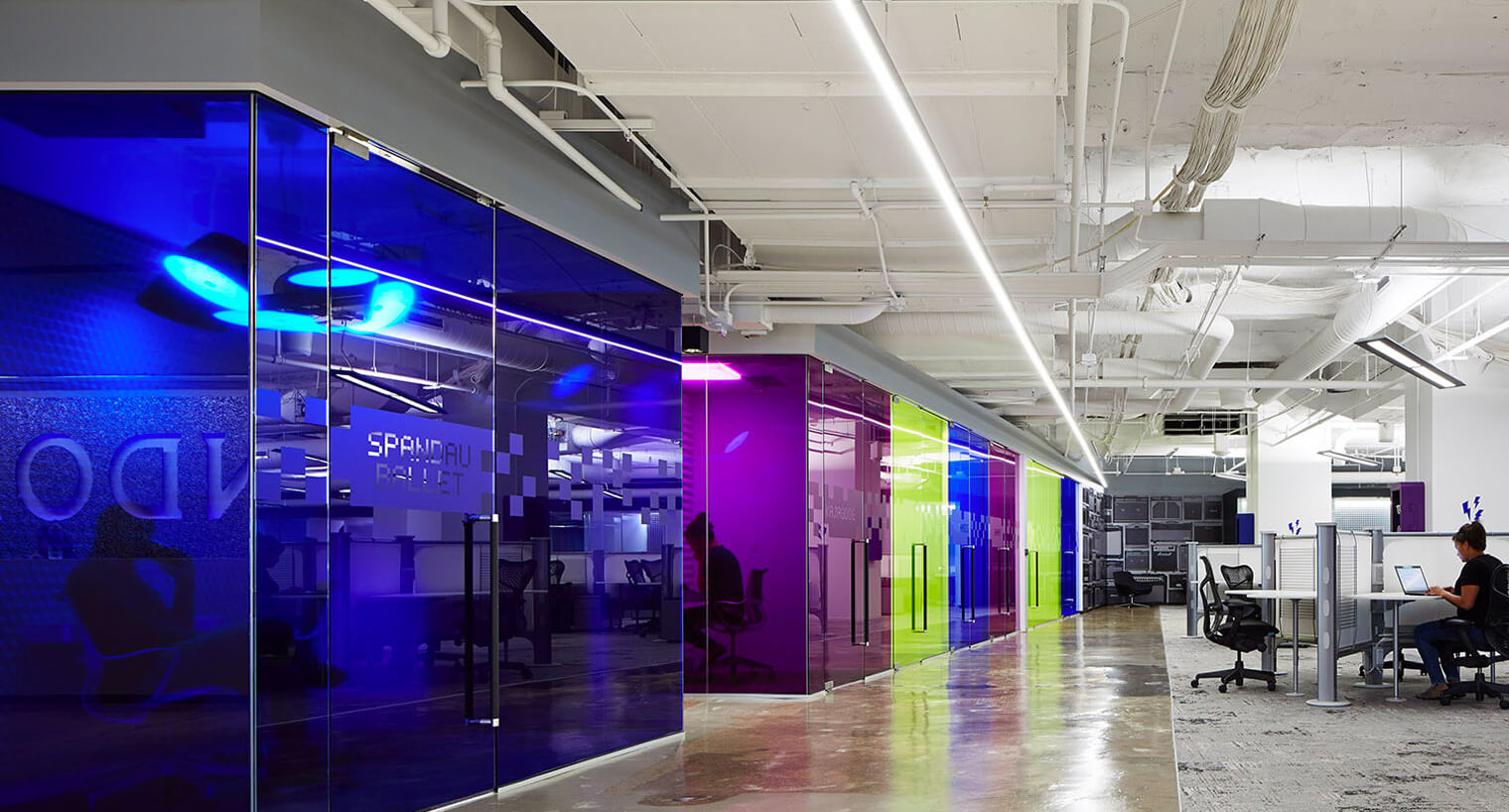 Brightly colored conference rooms at One Two Pru commercial office space
