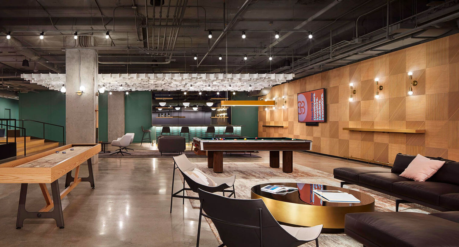 Game room with pool table, tabletop shuffleboard, and bar area