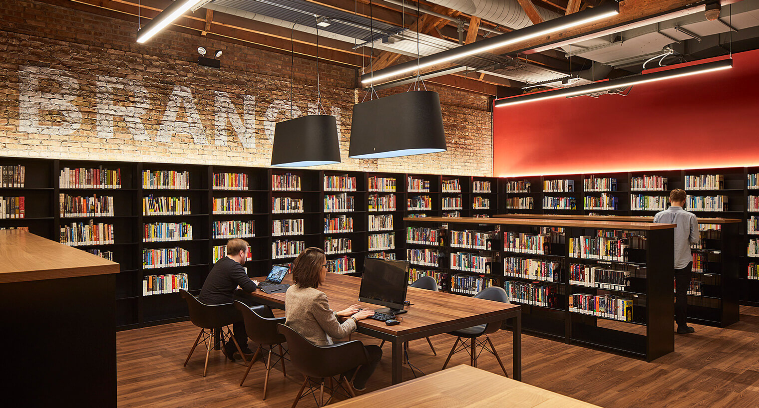 two people working on computers in the chicago library